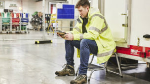 Site auditor looking at data on an ipad while sitting down